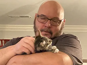 Bailey being held during a production meeting